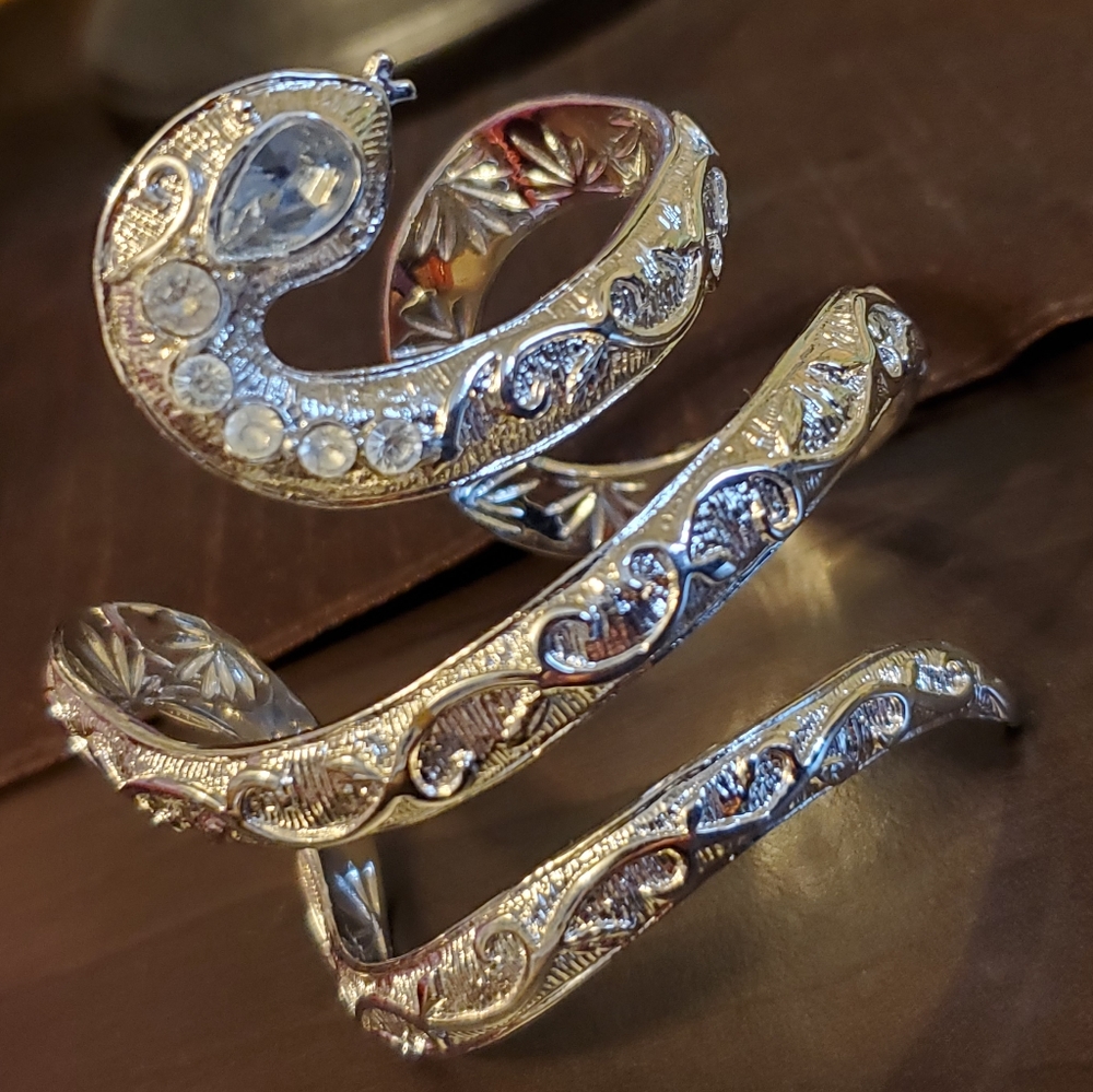 Silvertone textured snake cuff bracelet with blue marquis eye